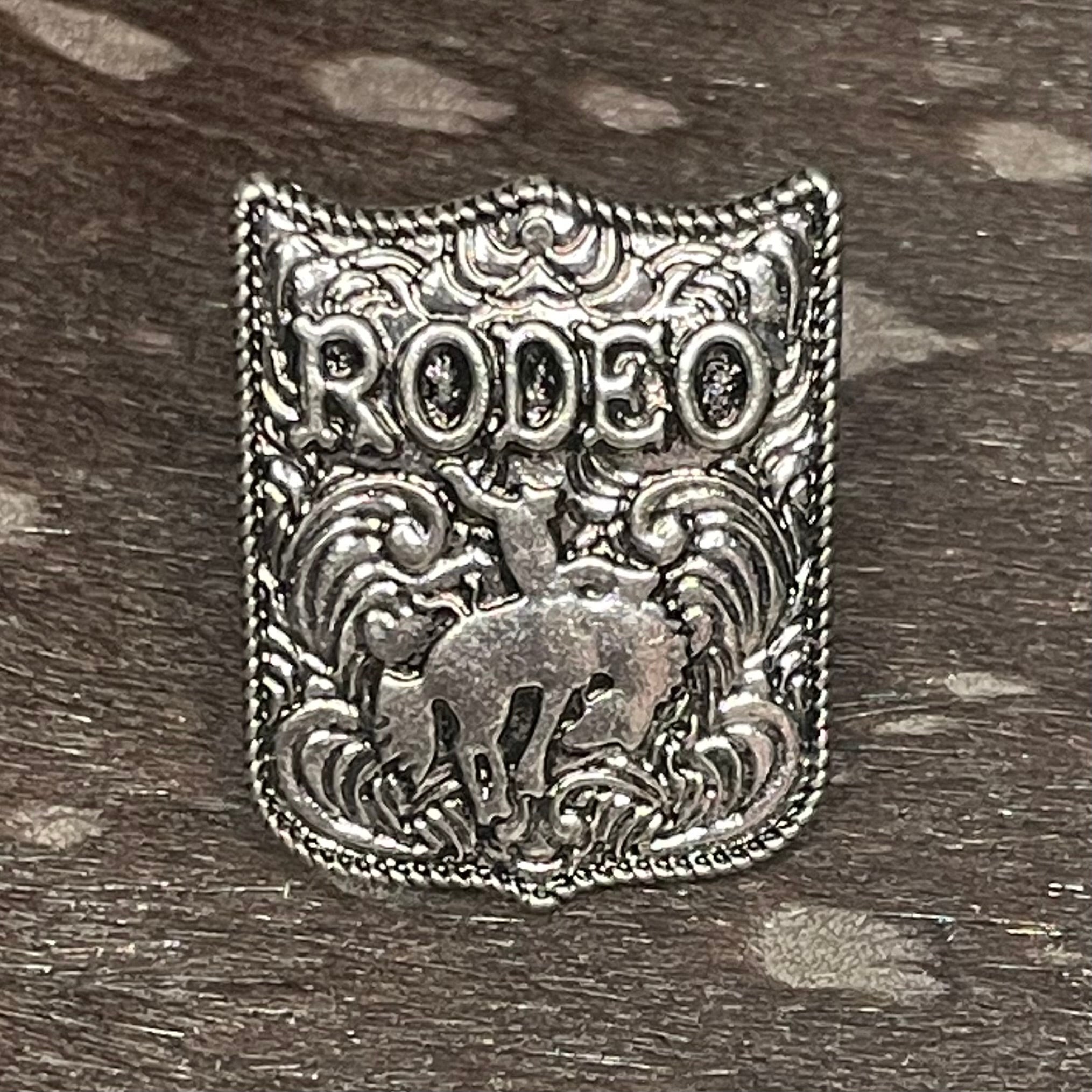 Silver ring with 'RODEO' text and horse design
