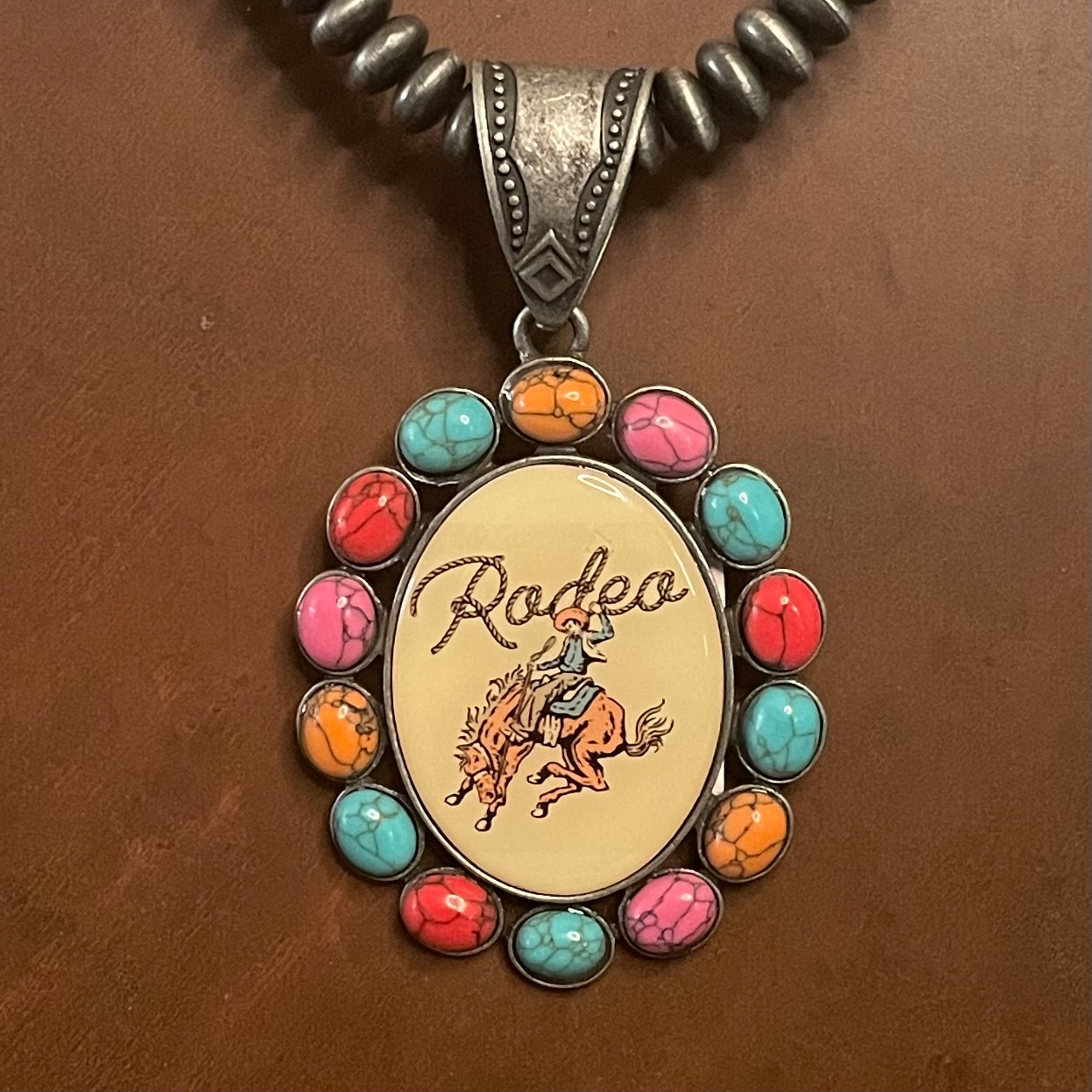 Multi-colored Faux Stone Pendant with Vintage Rodeo Cowboy Graphic